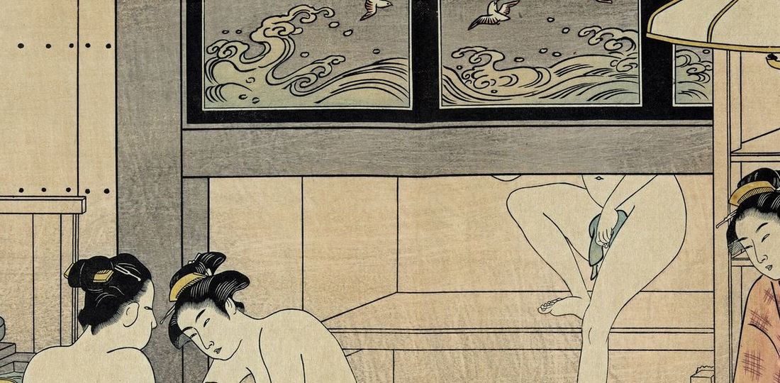 Detail of Kiyonaga's bathhouse: a wooden transom carved with a pattern of waves and flying plovers above the bathers.